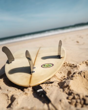 Surf lesson - surf board on beach
