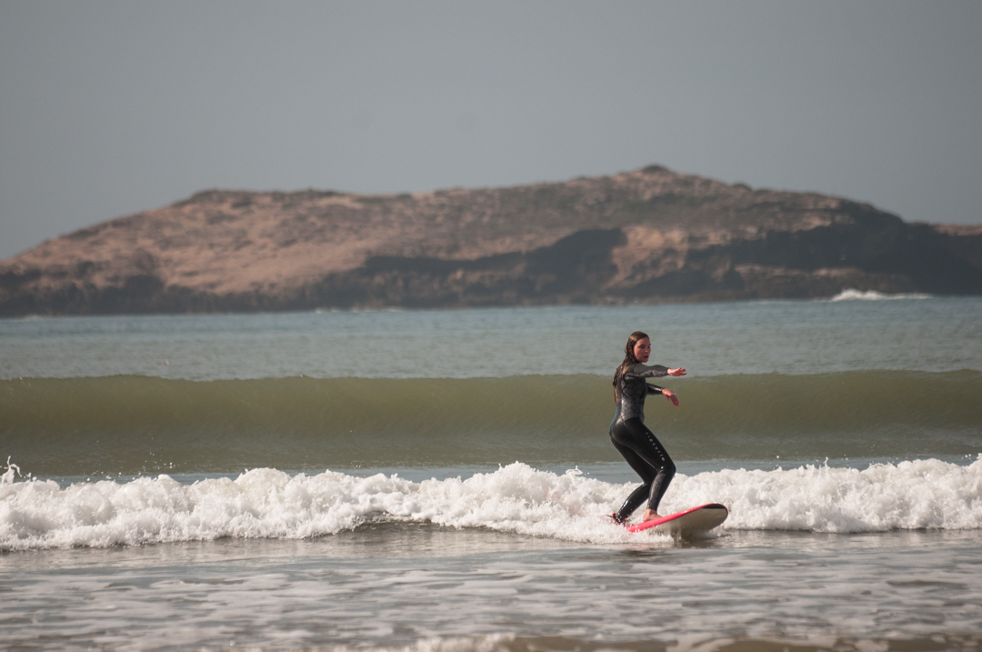 surfer riding wave in Essaouira with her private surf lesson with Loving Surf